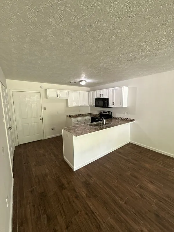 Bright & Open 3-Bedroom Home with Cozy Front Porch — Photo 3