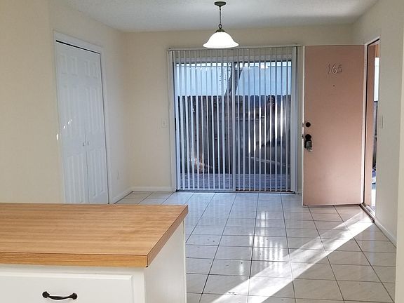 Dining room with deck and door to car port.