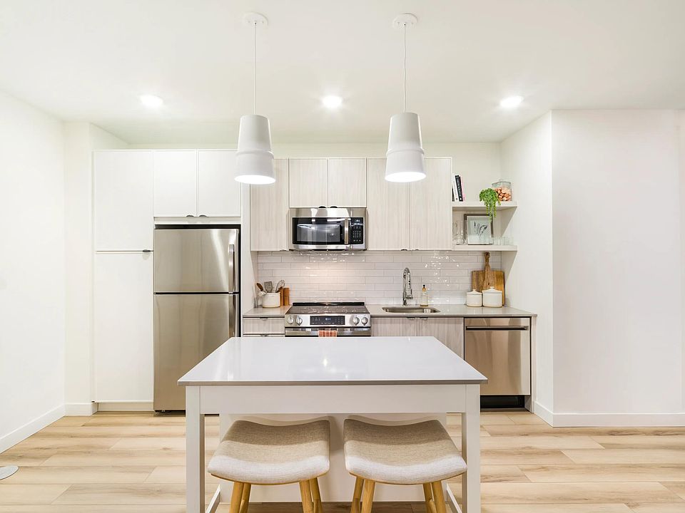 A streamlined kitchen with clean lines, ample storage, and a flexible island for everyday dining.