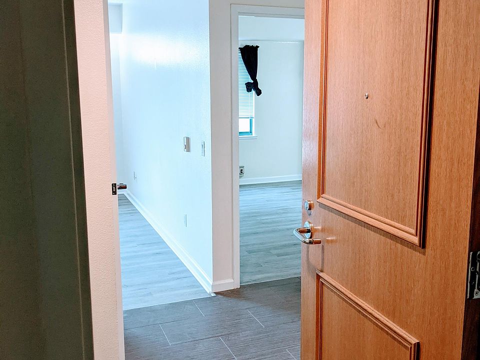 Entry. Living room and kitchen to the left. Bedroom and bath to the right.