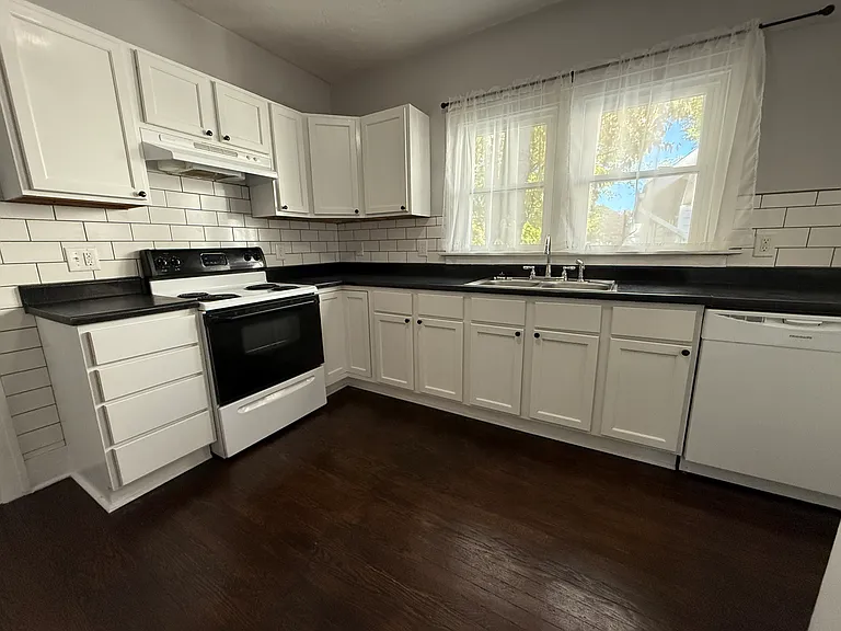 Kitchen includes range, refrigerator, dishwasher