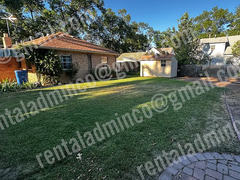 Large fenced backyard.