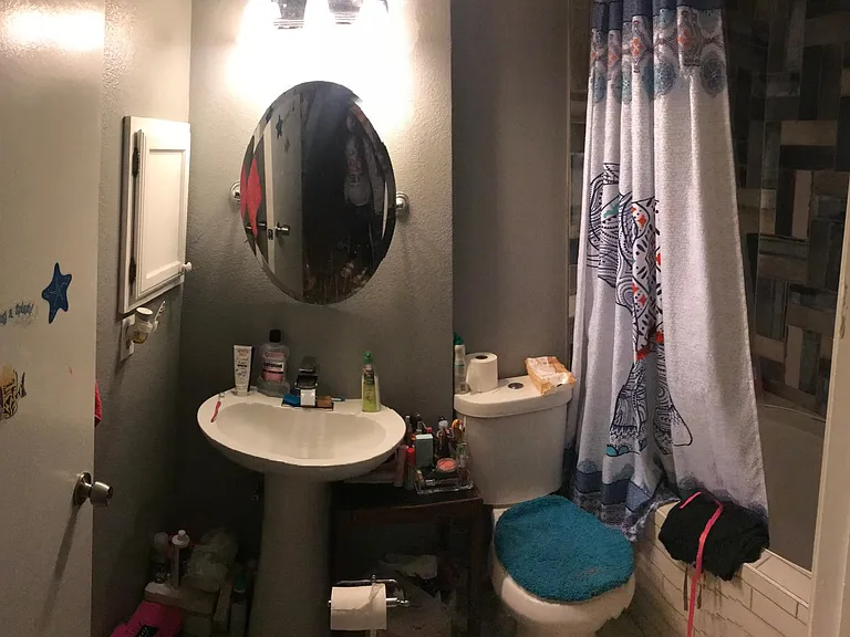 Upstairs Full bath features upgraded eco-friendly toilet, pedestal sink and oversized tub.