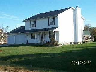 Front of home-attached oversized 3 car heated garage