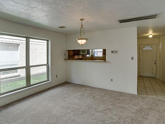 Kitchen has a pass-through bar.