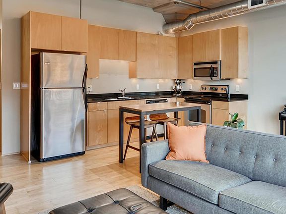 Maple cabinetry and quartz countertops.