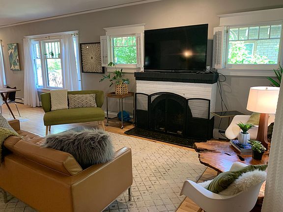 Living room, fireplace, new mahogany hardwood floors.
