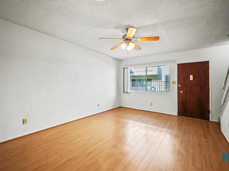 Living Room and Staircase to the Upper Townhome
