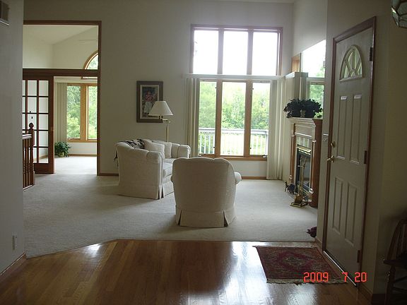 Living Room looking into Sunroom and Deck