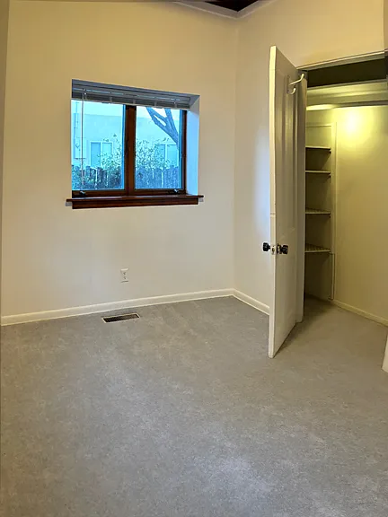 Another view of the smaller bedroom showing the closet