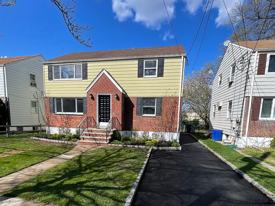 Beautiful two-family home with private first-floor apartment and separate lower-level suite with dedicated driveway parking with easy private access to the main level.