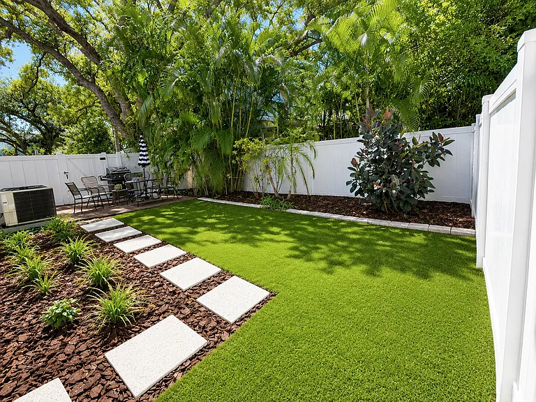 fully fenced yard + patio, 2nd bedroom leads to patio, brand new turf and landscaping