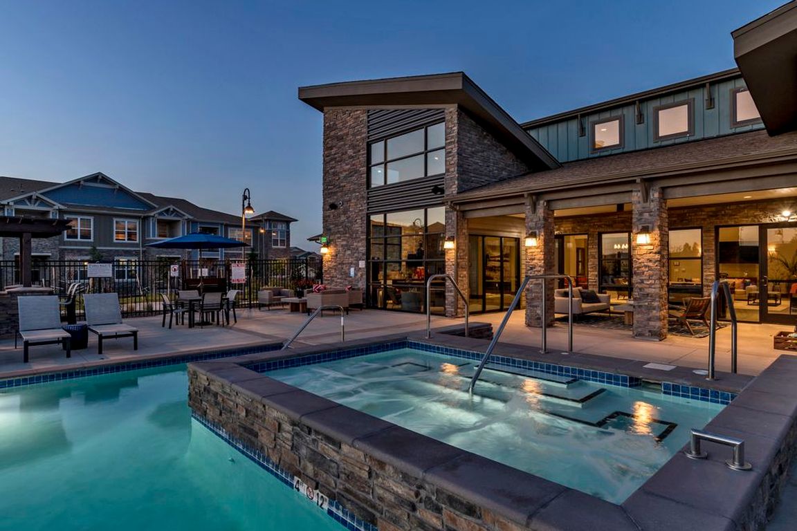 Outdoor lounge with swimming pool, spa and sundeck with lounge seating