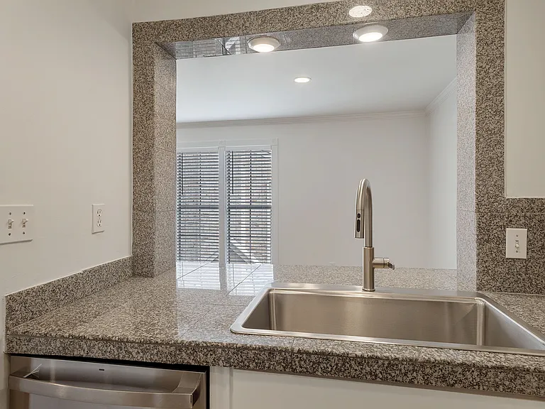 Breakfast bar opens up the space between the kitchen and dining area.