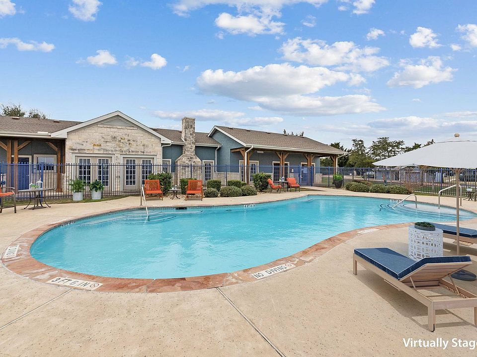 Beautiful swimming pool at Crescent Village Apartments, Elgin, TX, perfect for relaxation.