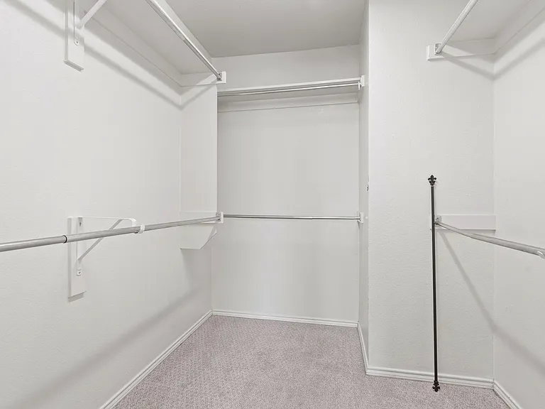 Primary closet is spacious