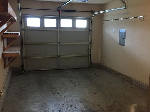 single car garage with shelving