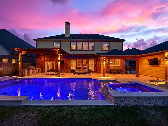 This outdoor space steals the show! A resort-style pool area and large deck have ample space for large outdoor furniture and entertaining.