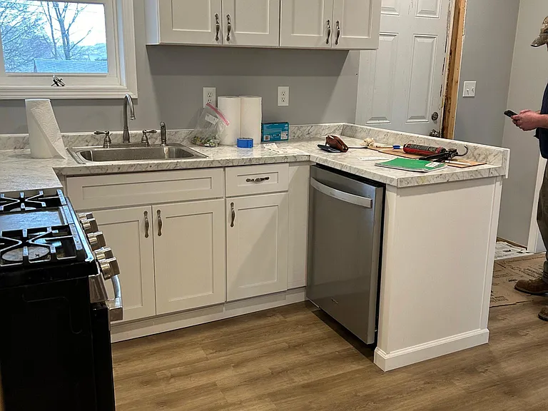 New cupboards and countertops. Built in dishwasher. Waiting on roof repair to get the door framed in.