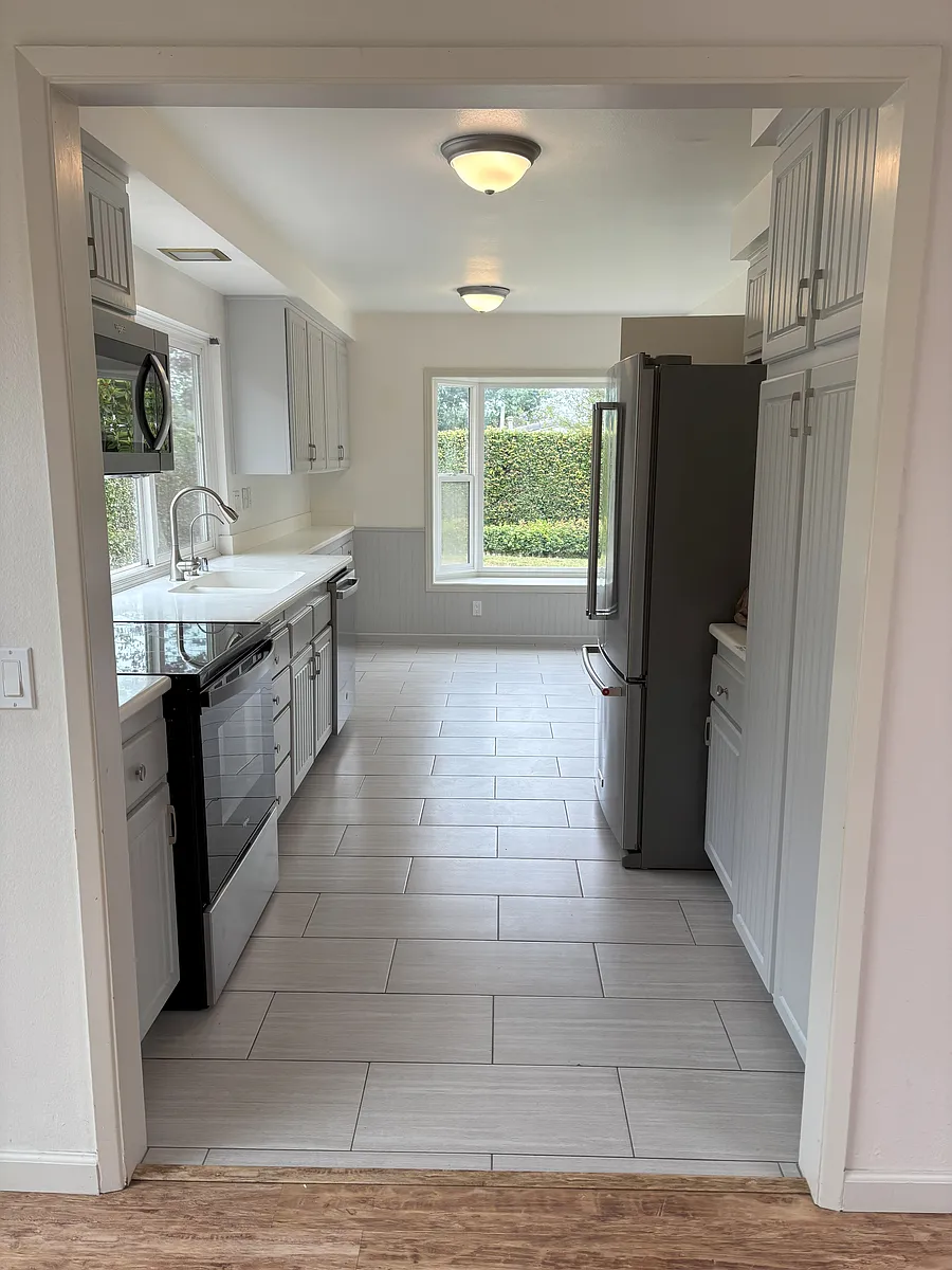 Kitchen breakfast nook and window seat overlooks the yard. Solid surface white countertops. Refrigerator included. - 19451 Sierra Luna Rd