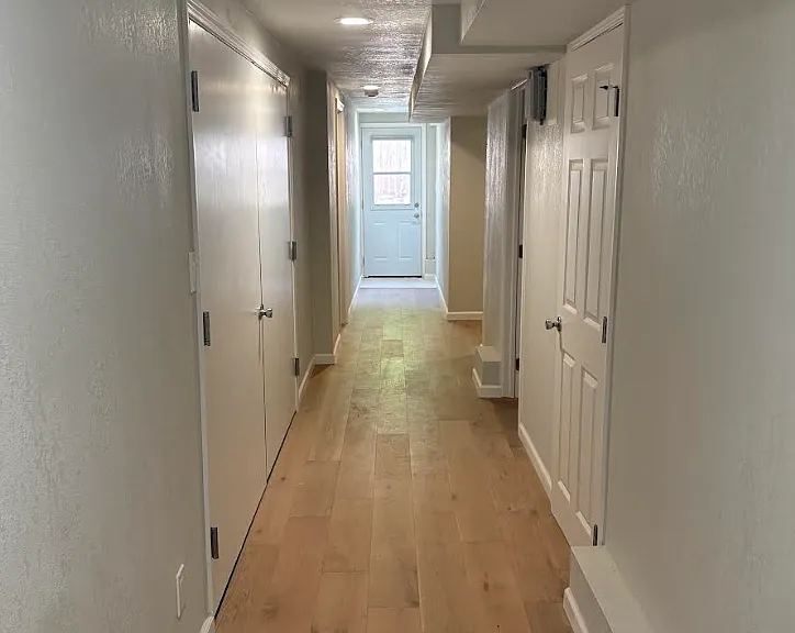 Downstairs deep and wide hallway, leading to backyard