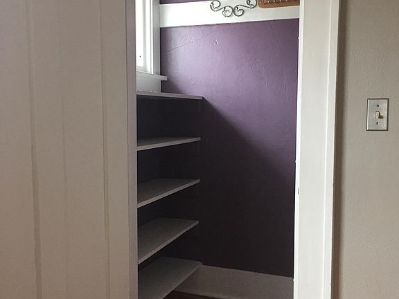 Bedroom closet with built in shelves