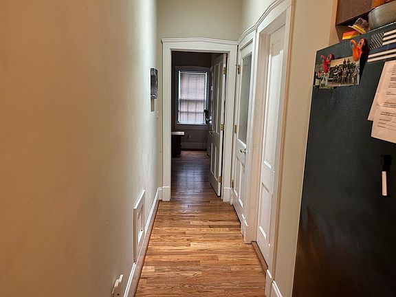 Hallway to two bedrooms and two bathrooms