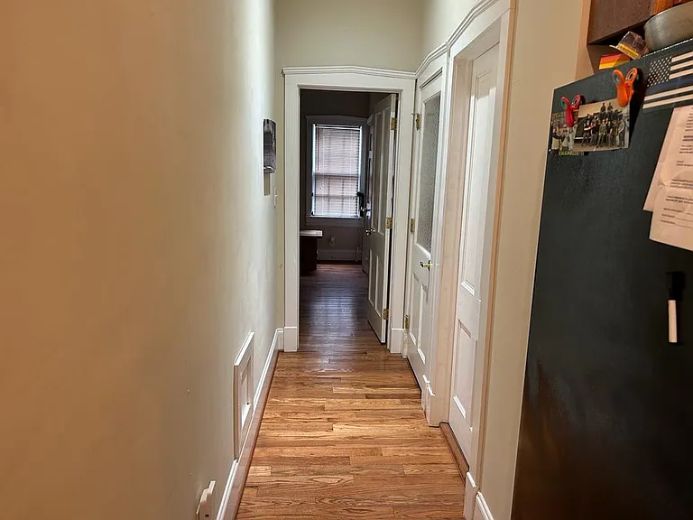 Hallway to two bedrooms and two bathrooms