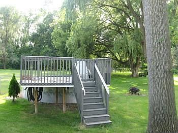 Above ground pool in a fenced yard 321 ft deep