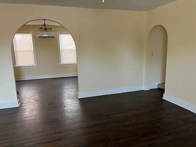 Living Room shows Arched Doorways