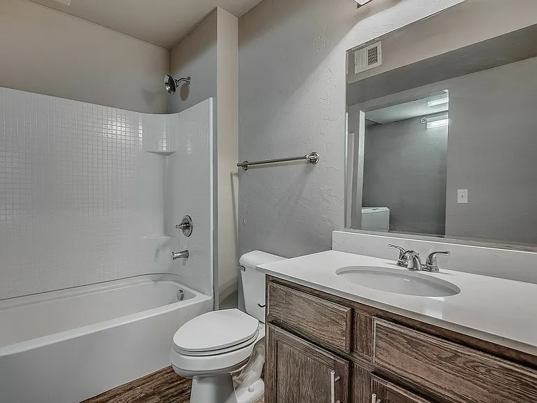 Experience comfort and style in this pristine bathroom, designed with modern elegance.