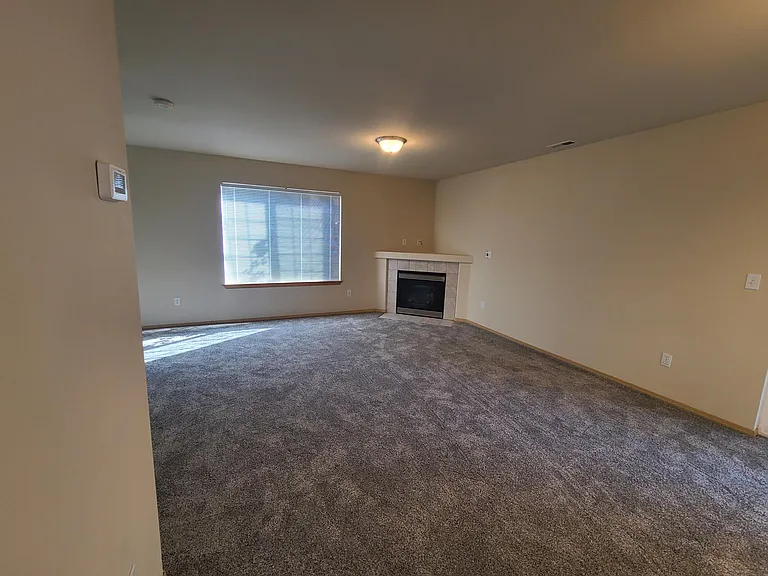 Living room with gas fireplace.
