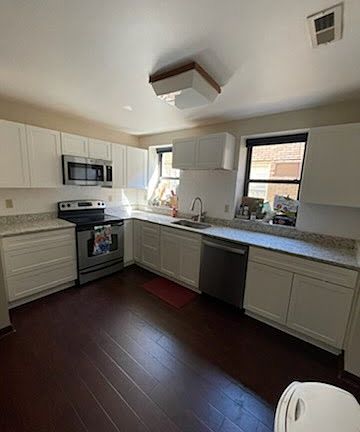 Large, newly renovated kitchen with granite counters.