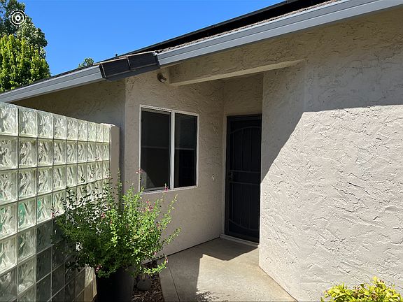 Front door is through courtyard on side of house.
