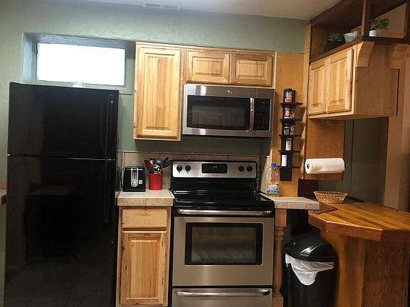 full sized stove, refrigerator and microwave. Pots and pans included.