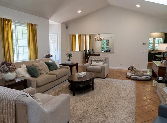 Large living room with fireplace and French tile.