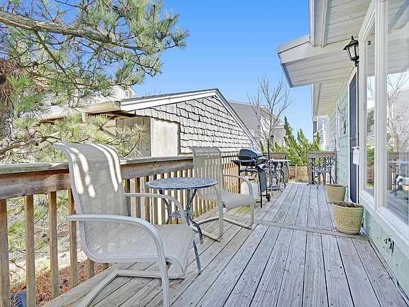 Deck off unit 2 with grill and furniture