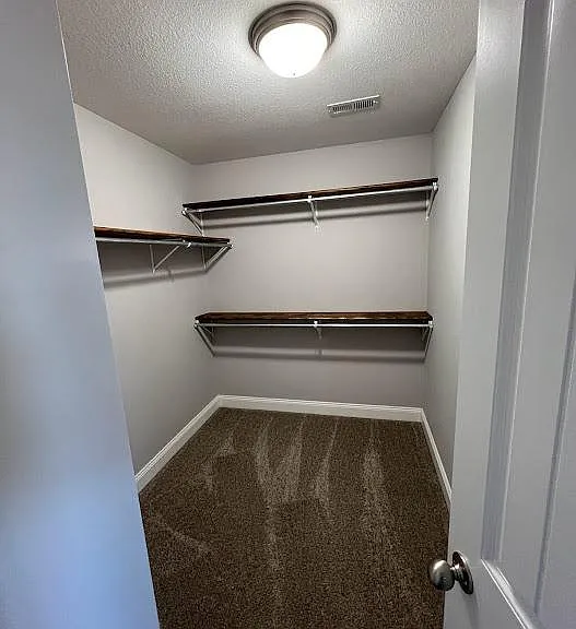 1 of 2 large walk in closets for the master suite
