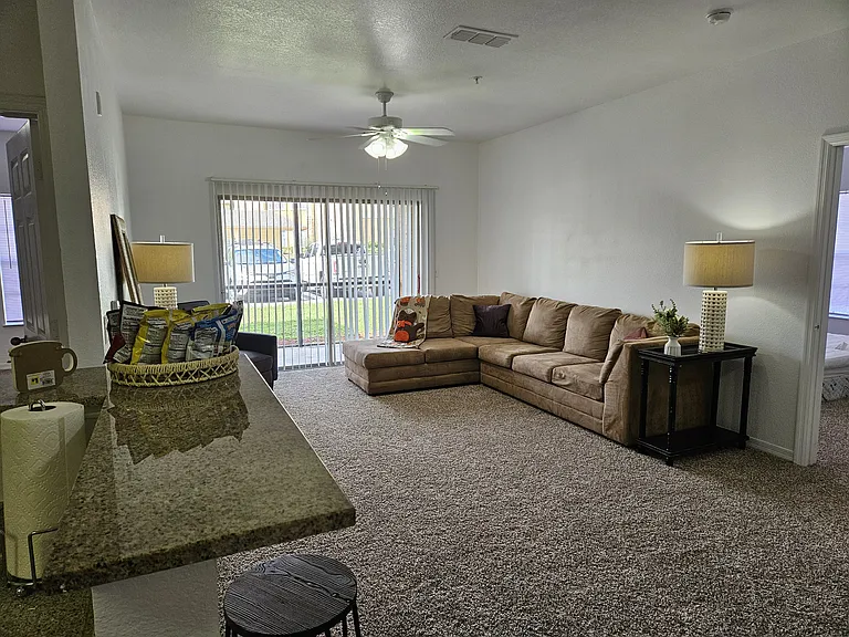 Bright and inviting living room with an open layout, ample natural light, and plenty of space for relaxing or entertaining.