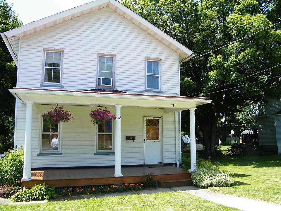 covered porch, driveway to left