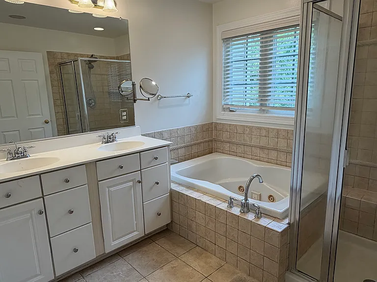 Owner's bath with Jacuzzi tub and double sinks