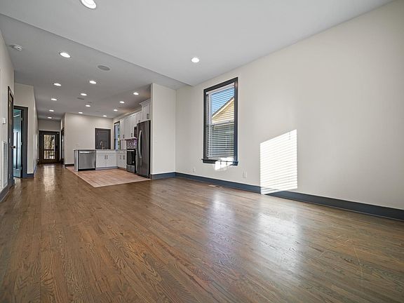 Downstairs living room space connected to the downstairs kitchen.