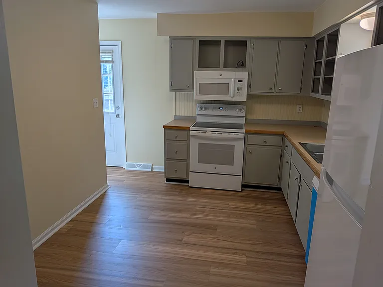 Kitchen and side exterior door (view from living room)