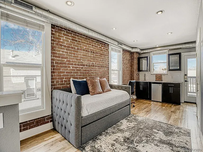 Loft entertainment area with wet bar