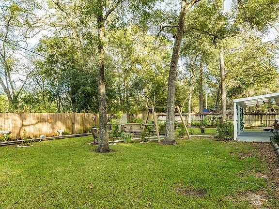 Fully fenced, great patio, and several trees!