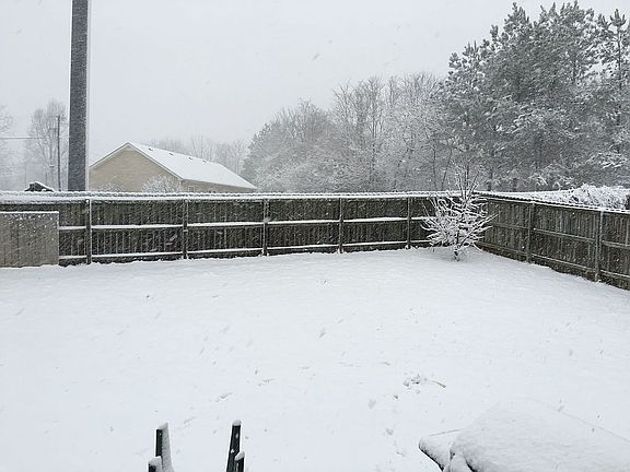 Half backyard in snow