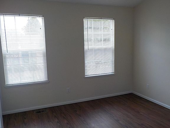 Front bedroom with laminate floor.