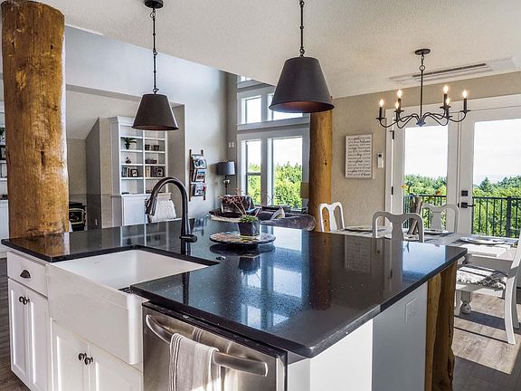 view from kitchen- pine log posts