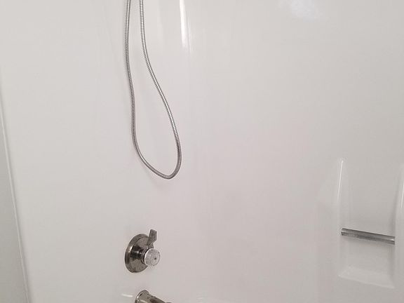 Full sized shower and tub