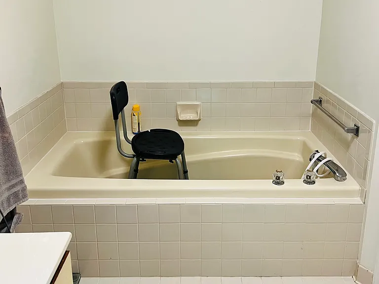 Large bathtub in master bathroom which also has a separate shower